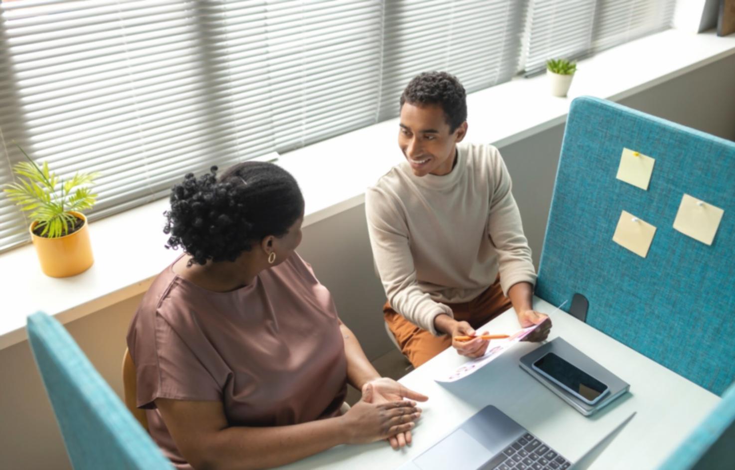 Financial analysts reviewing complex modeling frameworks on multiple screens